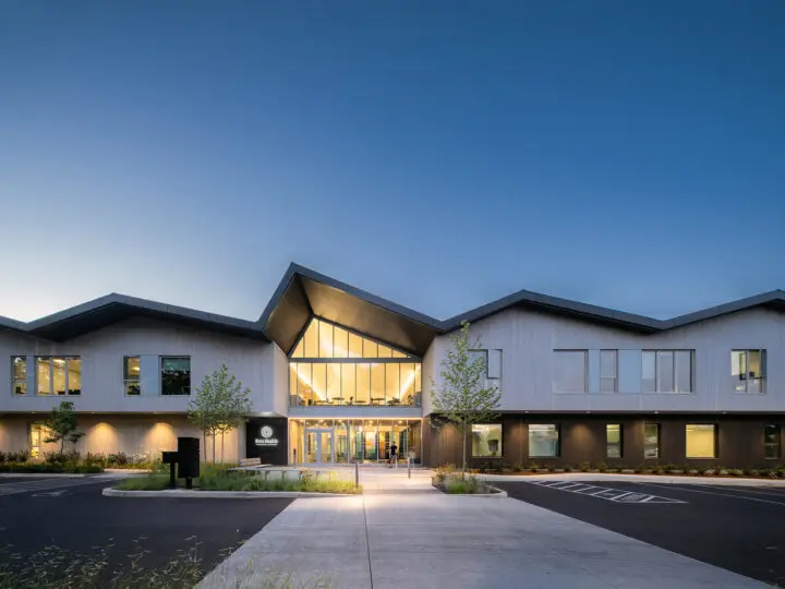 An image of Fora Health at dusk, viewed from the edge of the parking lot.