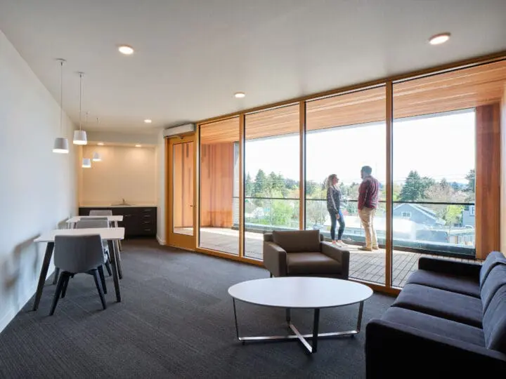 View of 72Foster’s 4th-floor community room, which features various seating options.