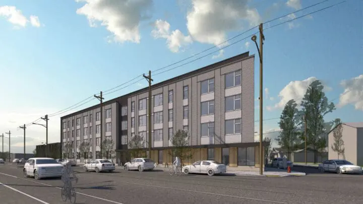An exterior rendering showing the width of 73Foster, an apartment building viewed from across the street.
