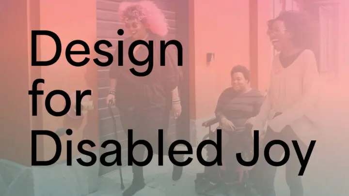 “Design for Disabled Joy” is written on top of an image of three Black and disabled folx laughing uproariously while strolling down a sidewalk on a windy day.